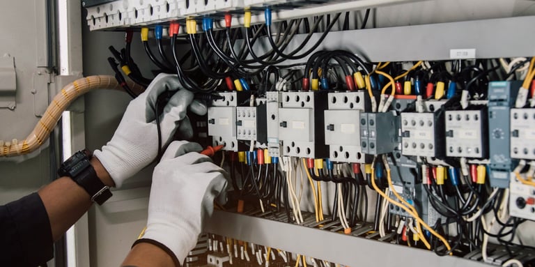 Electrician testing wires